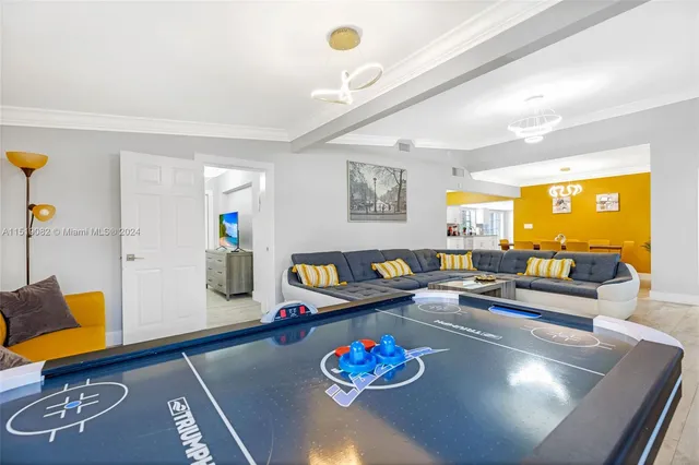 a living room with furniture and next to a window