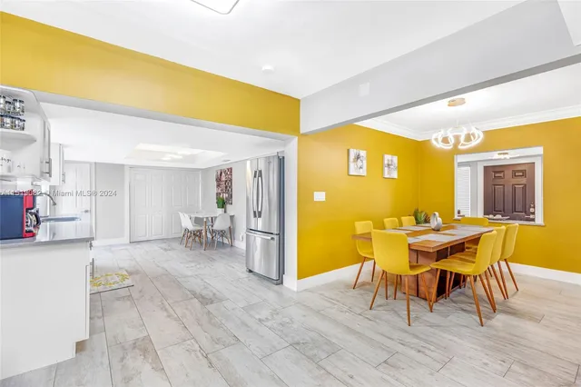 a view of a dining room with furniture and window