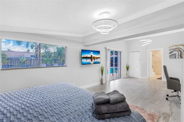 a bedroom with furniture and a window