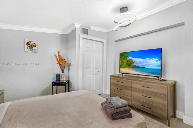 a bedroom with a bed and furniture