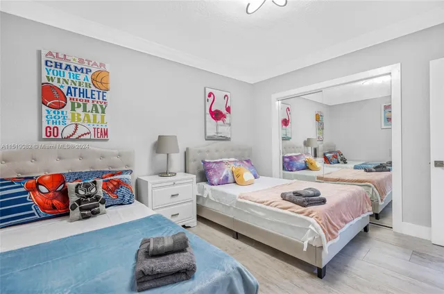 a bedroom with a bed and dresser