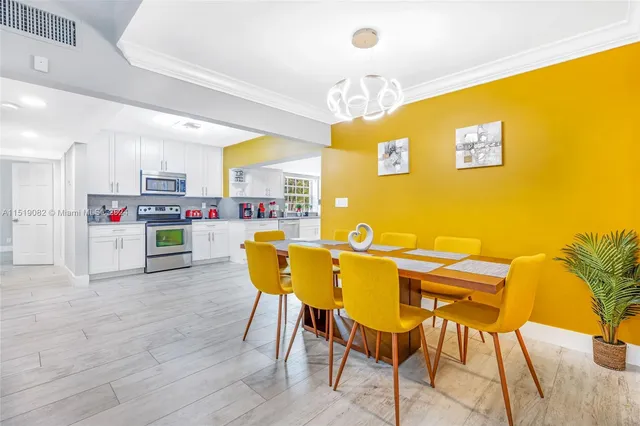 a view of kitchen with dining table and chairs