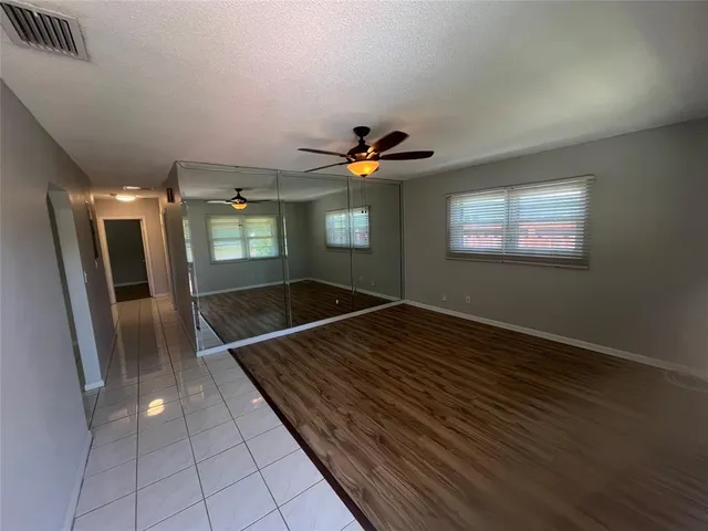a view of an empty room with a window