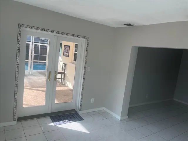 a view of an empty room with a window