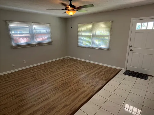 a view of an empty room with a window