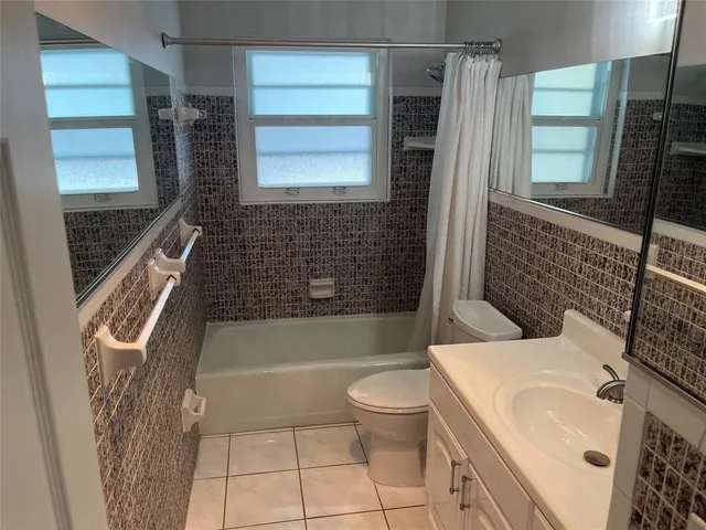 a view of an empty room and a window