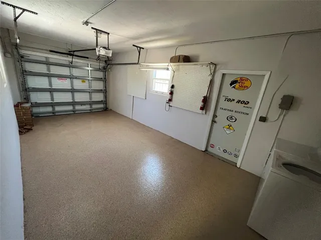 a kitchen with a stove a sink and a refrigerator
