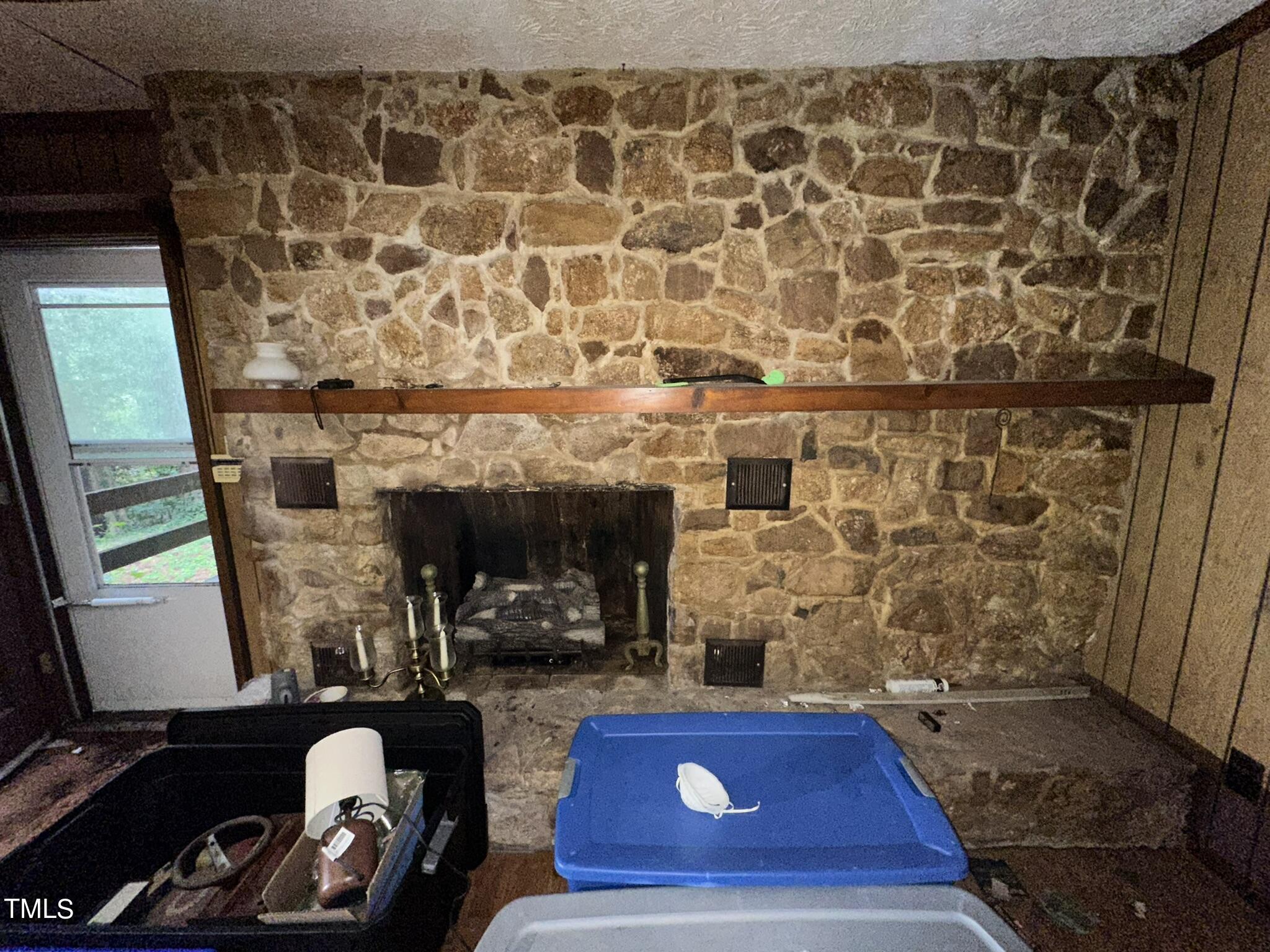 293 Nicholson Road Rockingham, NC 28379 - Photo 27 of 55 a room with a fireplace and a flat screen tv