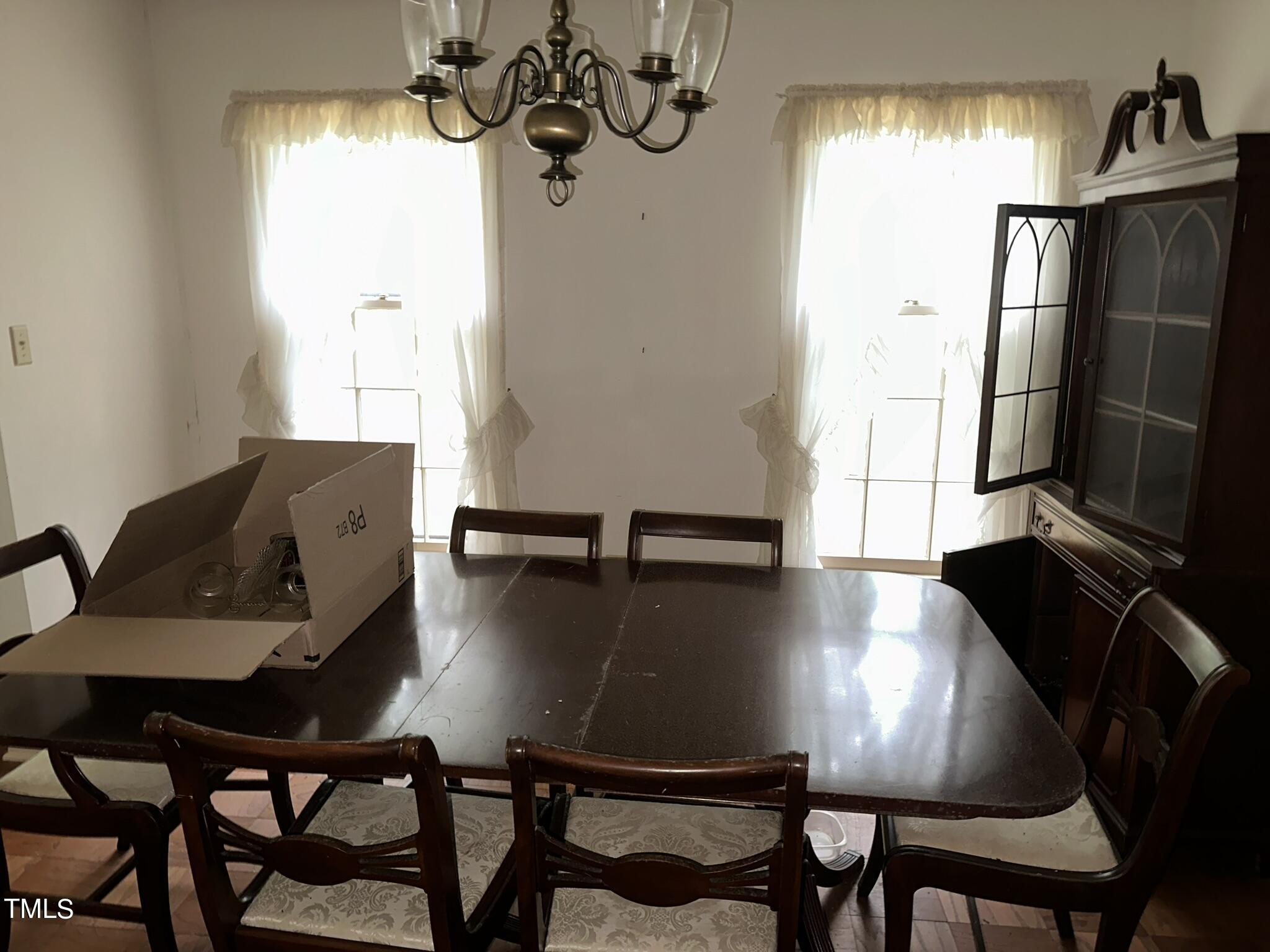 293 Nicholson Road Rockingham, NC 28379 - Photo 33 of 55 a view of a dining room with furniture and a chandelier