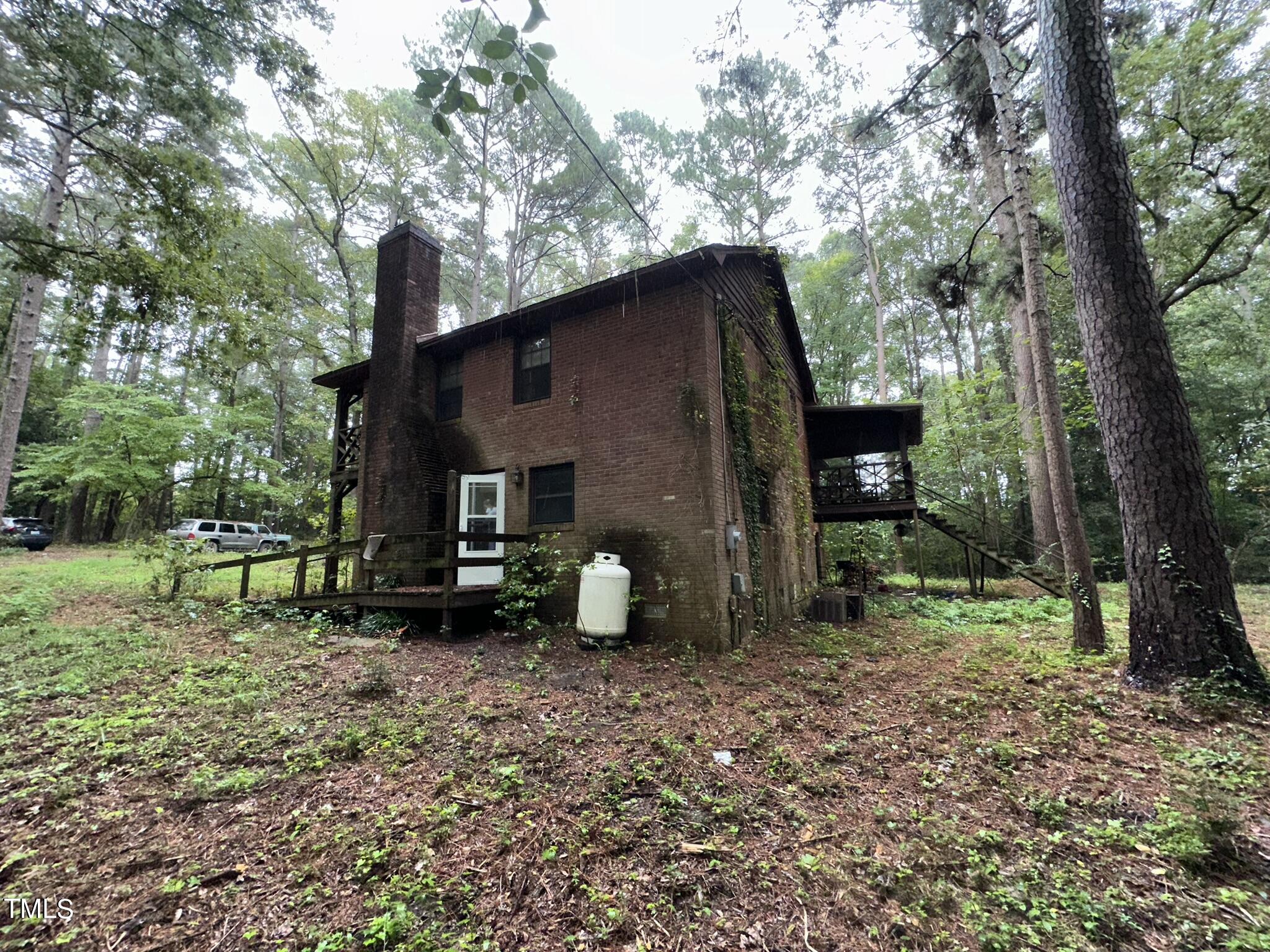293 Nicholson Road Rockingham, NC 28379 - Photo 8 of 55 a view of a house with backyard and garden
