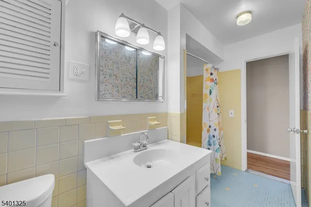 a view of an empty room and wooden floor