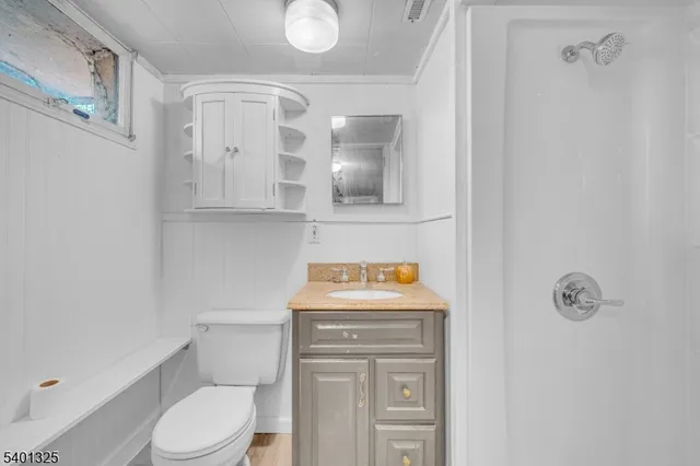 a kitchen with a refrigerator and a sink