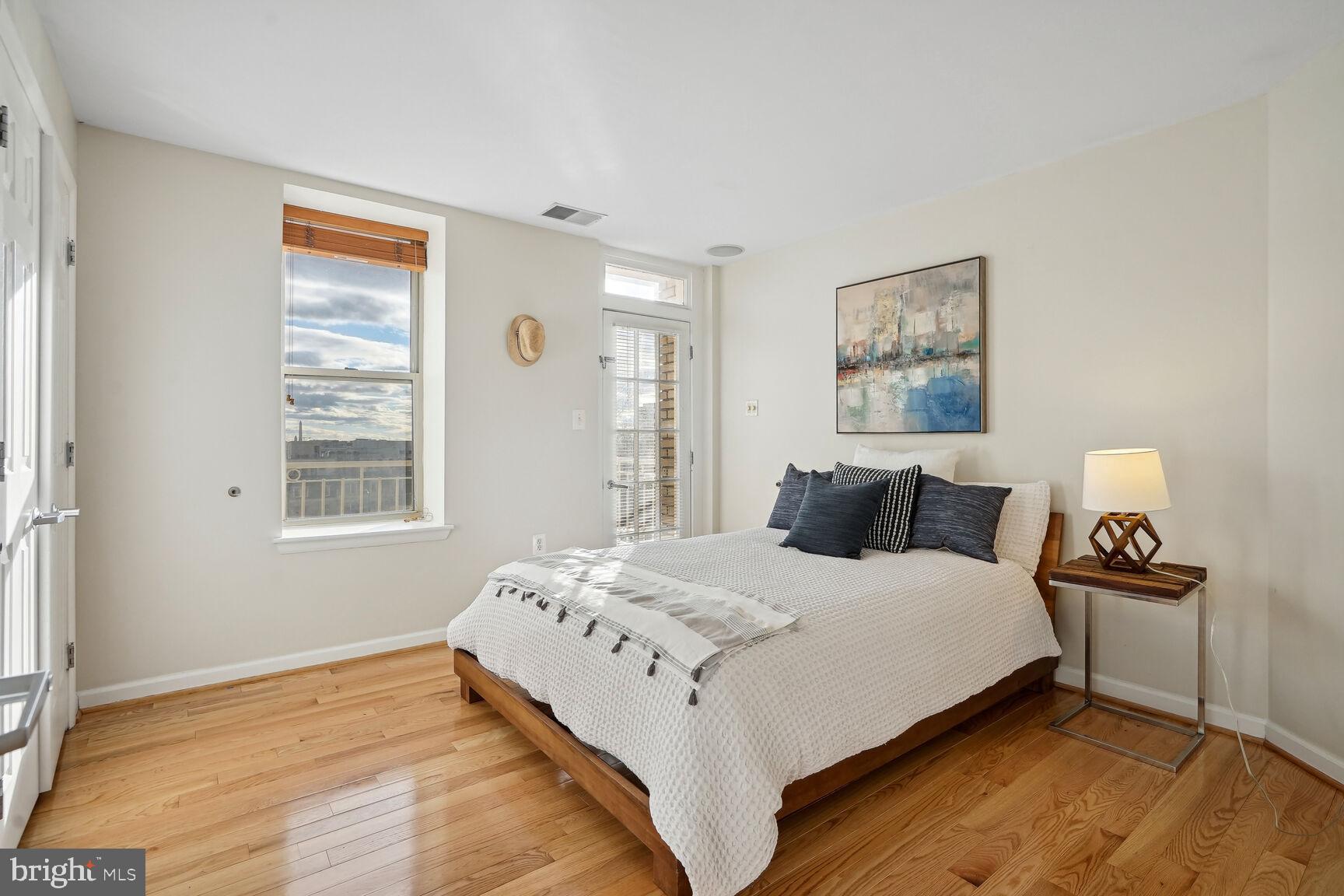 1308 Clifton Street Northwest, Unit 104 Washington, DC 20009 - Photo 12 of 24 a bedroom with bed and a window
