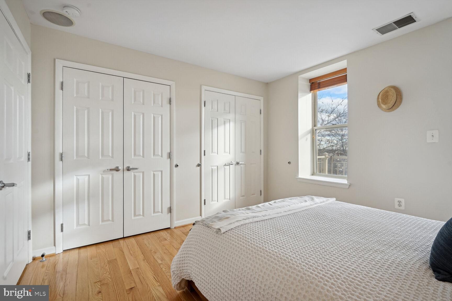 1308 Clifton Street Northwest, Unit 104 Washington, DC 20009 - Photo 14 of 24 a bedroom with a bed and a window