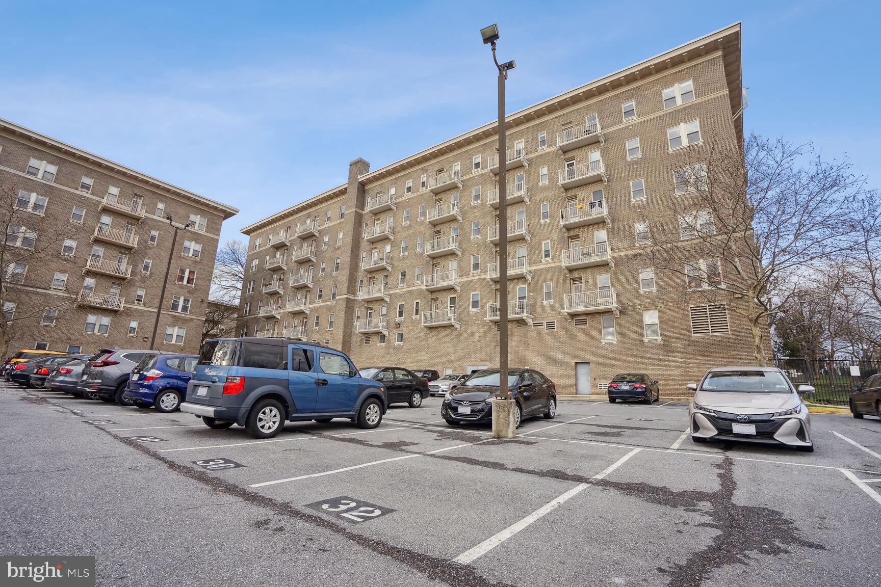 1308 Clifton Street Northwest, Unit 104 Washington, DC 20009 - Photo 23 of 24 a view of a cars parked in front of a building