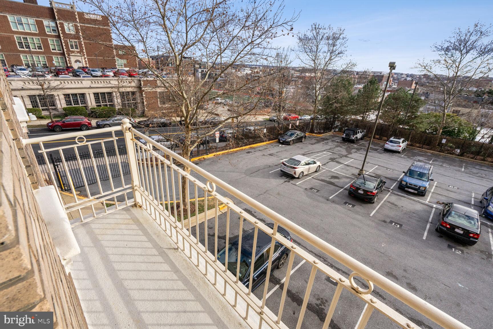 1308 Clifton Street Northwest, Unit 104 Washington, DC 20009 - Photo 5 of 24 a view of a balcony with two chairs and a table
