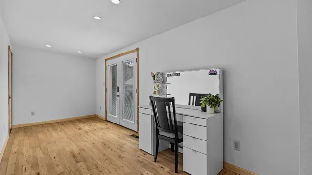 a room with furniture and wooden floor