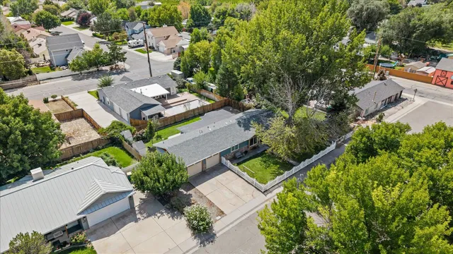 an aerial view of a house with garden space and street view