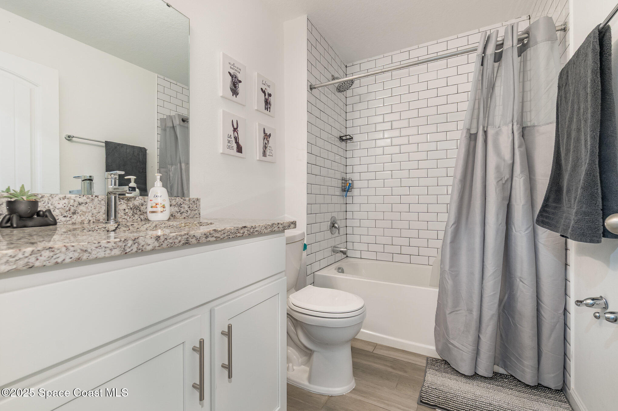 1534 Pine Street Orlando, FL 32824 - Photo 22 of 31 a bathroom with a granite countertop sink toilet and shower