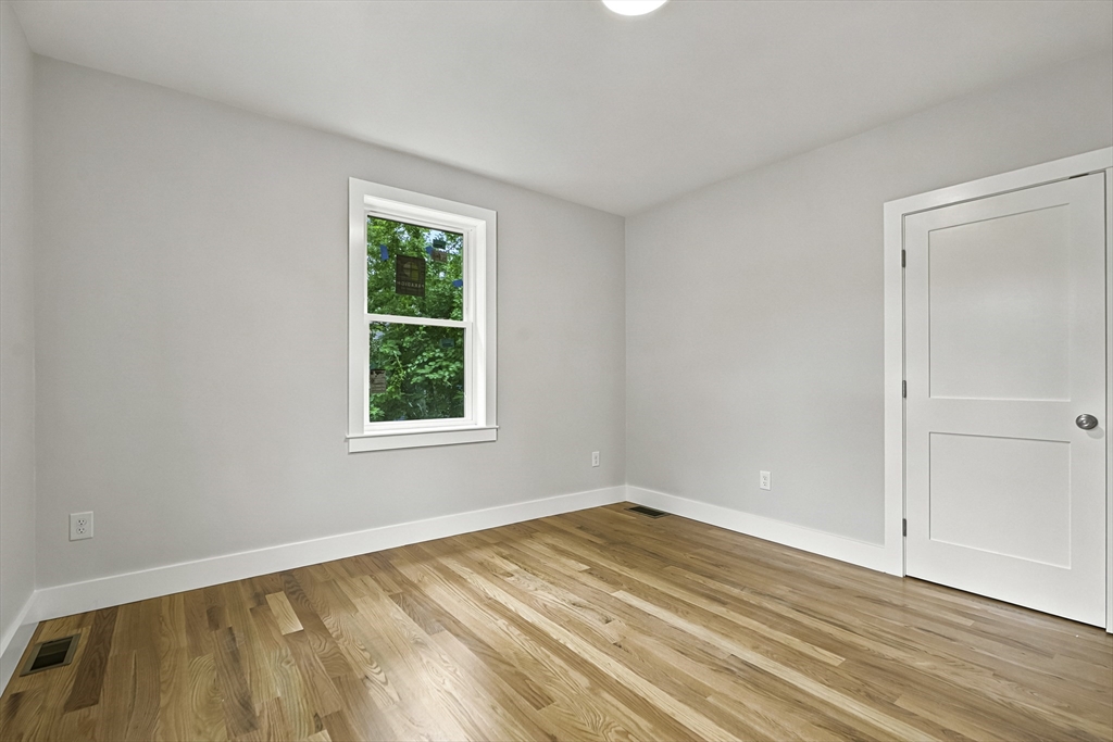 4 Mayhew Street Framingham, MA 01702 - Photo 16 of 42 a view of a room that has a window in it