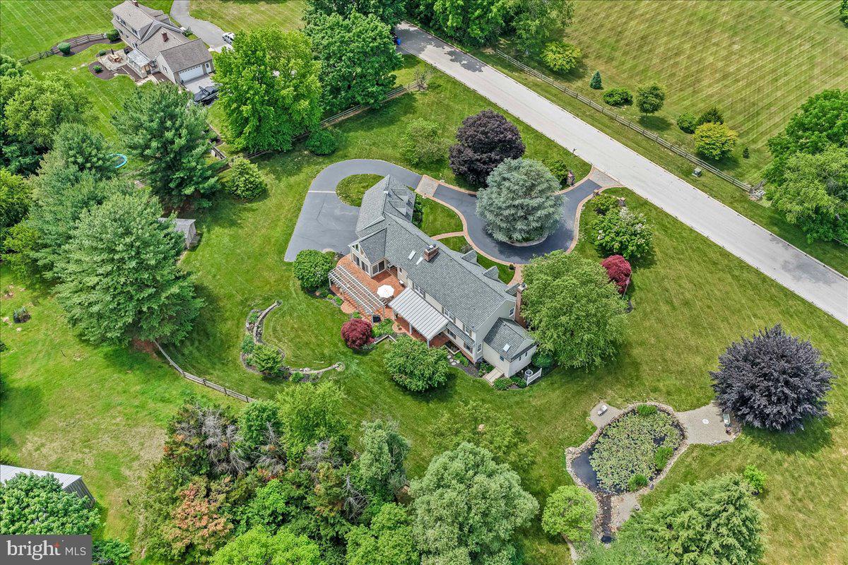 7 Bolingbroke Road West Chester, PA 19382 - Photo 53 of 86 Lush greenery surrounds a charming home.