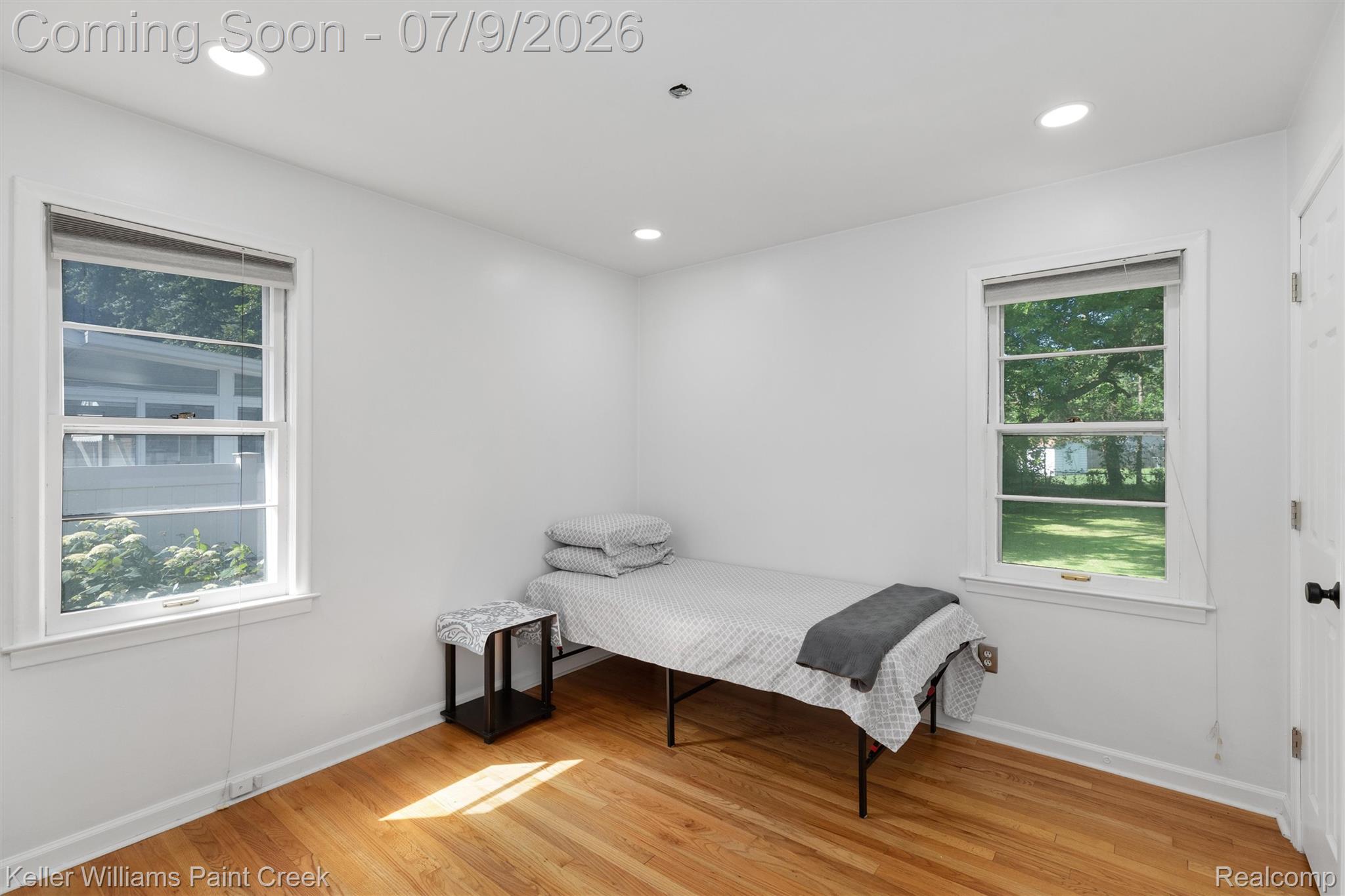 2731 Crooks Road Royal Oak, MI 48073 - Photo 6 of 34 Room with hardwood flooring, recessed lighting, and white walls