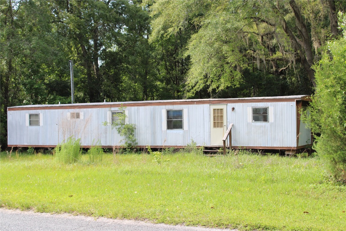 481218 Haddock Road Hilliard, FL 32046 - Photo 27 of 27 a view of backyard with large trees