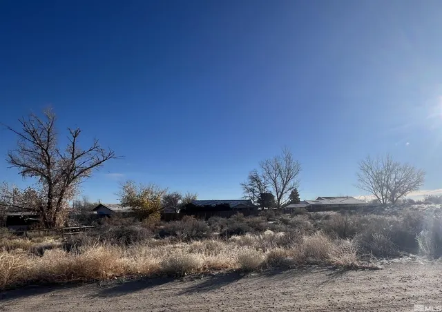 a view of a house with a street
