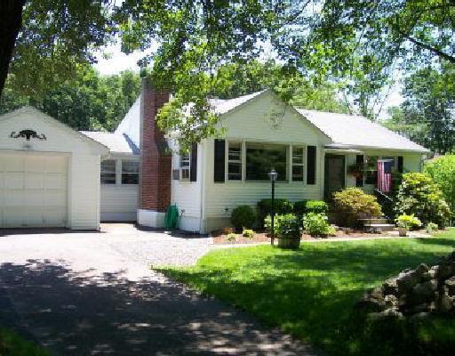 35 Milltown Road Danbury, CT 06811 - Photo 1 of 1 a front view of a house with yard and green space