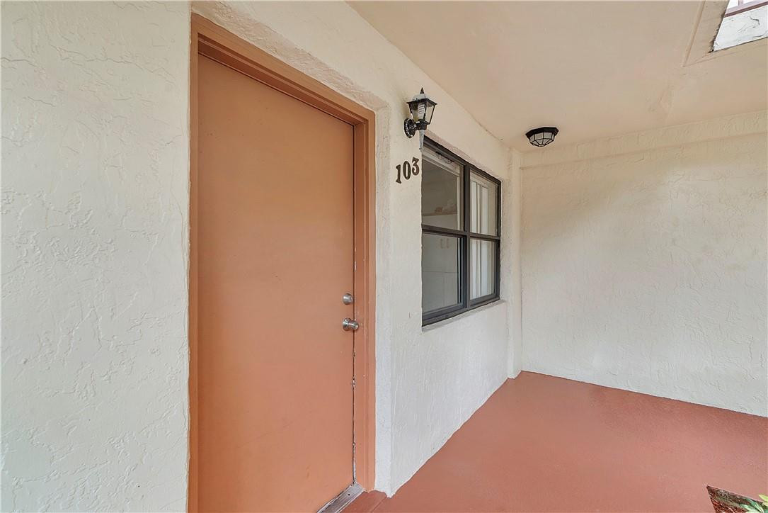 7401 Northwest 16th Street, Unit 103 Plantation, FL 33313 - Photo 2 of 12 a view of hallway with stairs