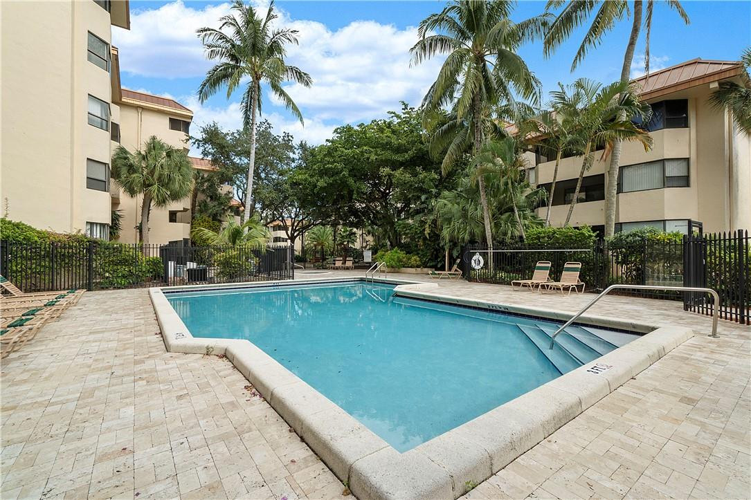 7401 Northwest 16th Street, Unit 103 Plantation, FL 33313 - Photo 10 of 12 a view of swimming pool with outdoor seating and a potted plant