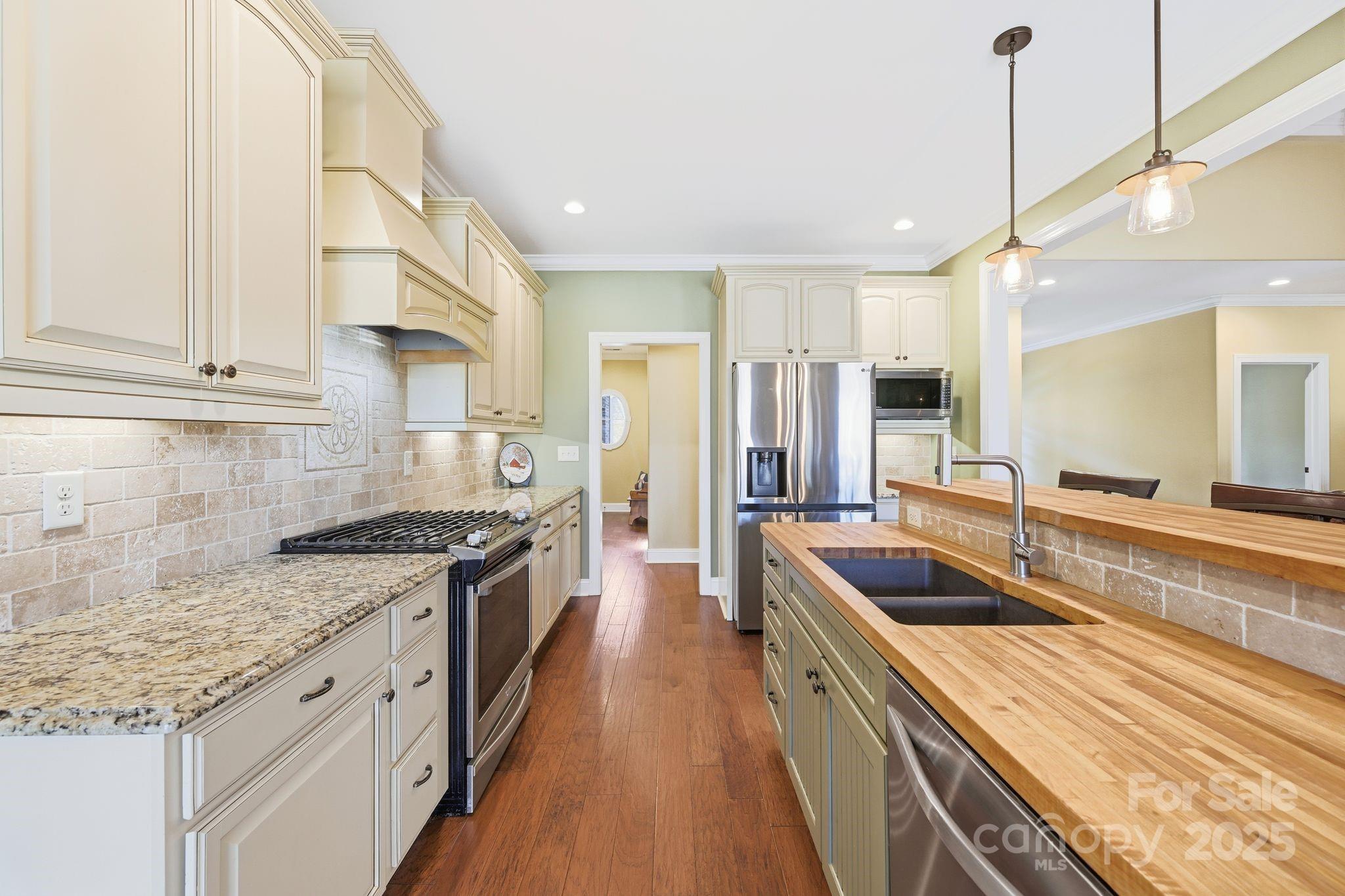476 Ijames Church Road Mocksville, NC 27028 - Photo 11 of 48 a kitchen with granite countertop a sink a counter top space stainless steel appliances and cabinets