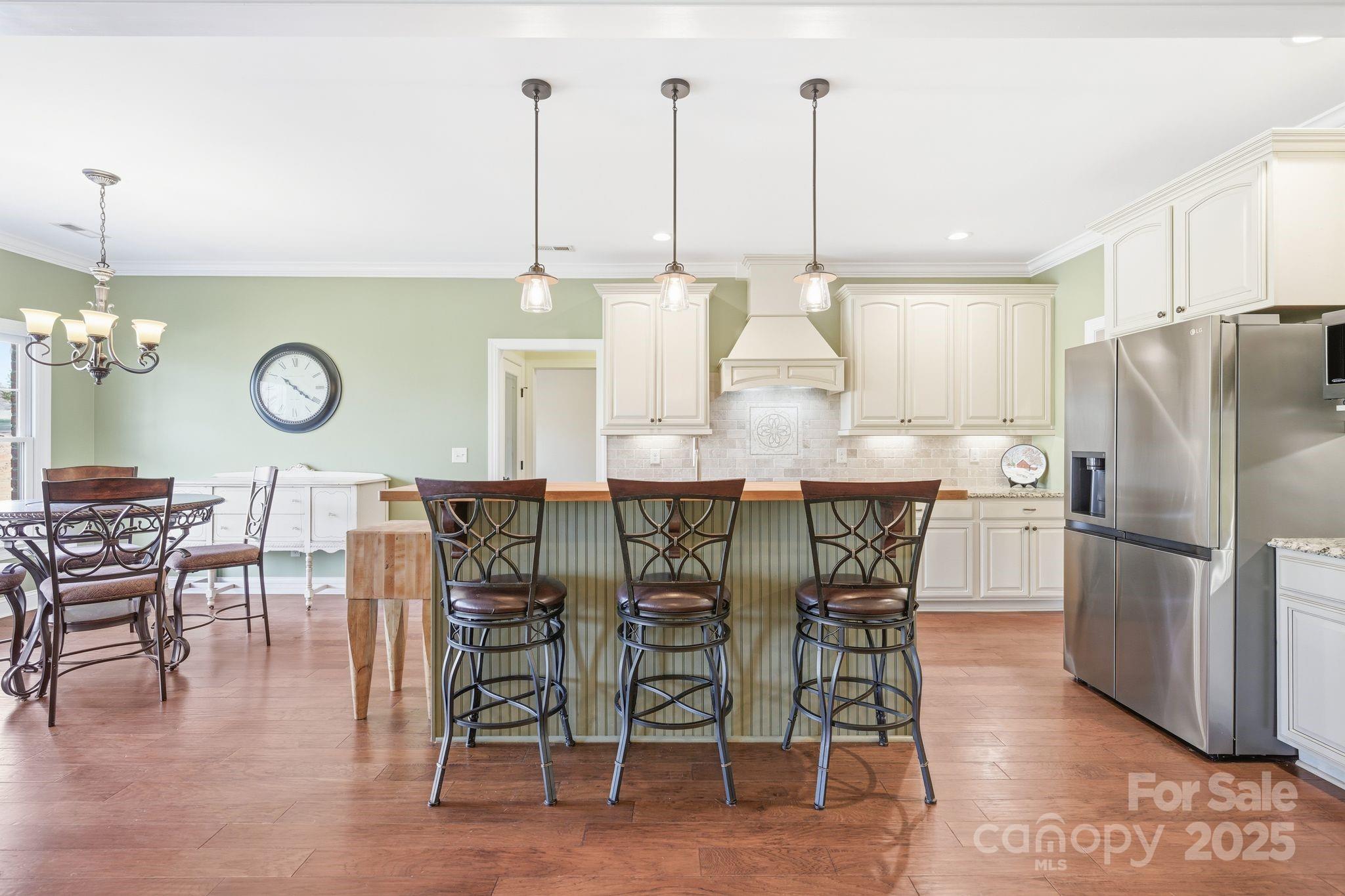 476 Ijames Church Road Mocksville, NC 27028 - Photo 12 of 48 a kitchen with stainless steel appliances granite countertop a table chairs stove and cabinets