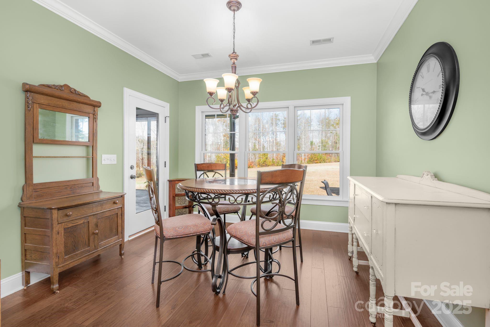 476 Ijames Church Road Mocksville, NC 27028 - Photo 14 of 48 a dining room with furniture a chandelier and wooden floor