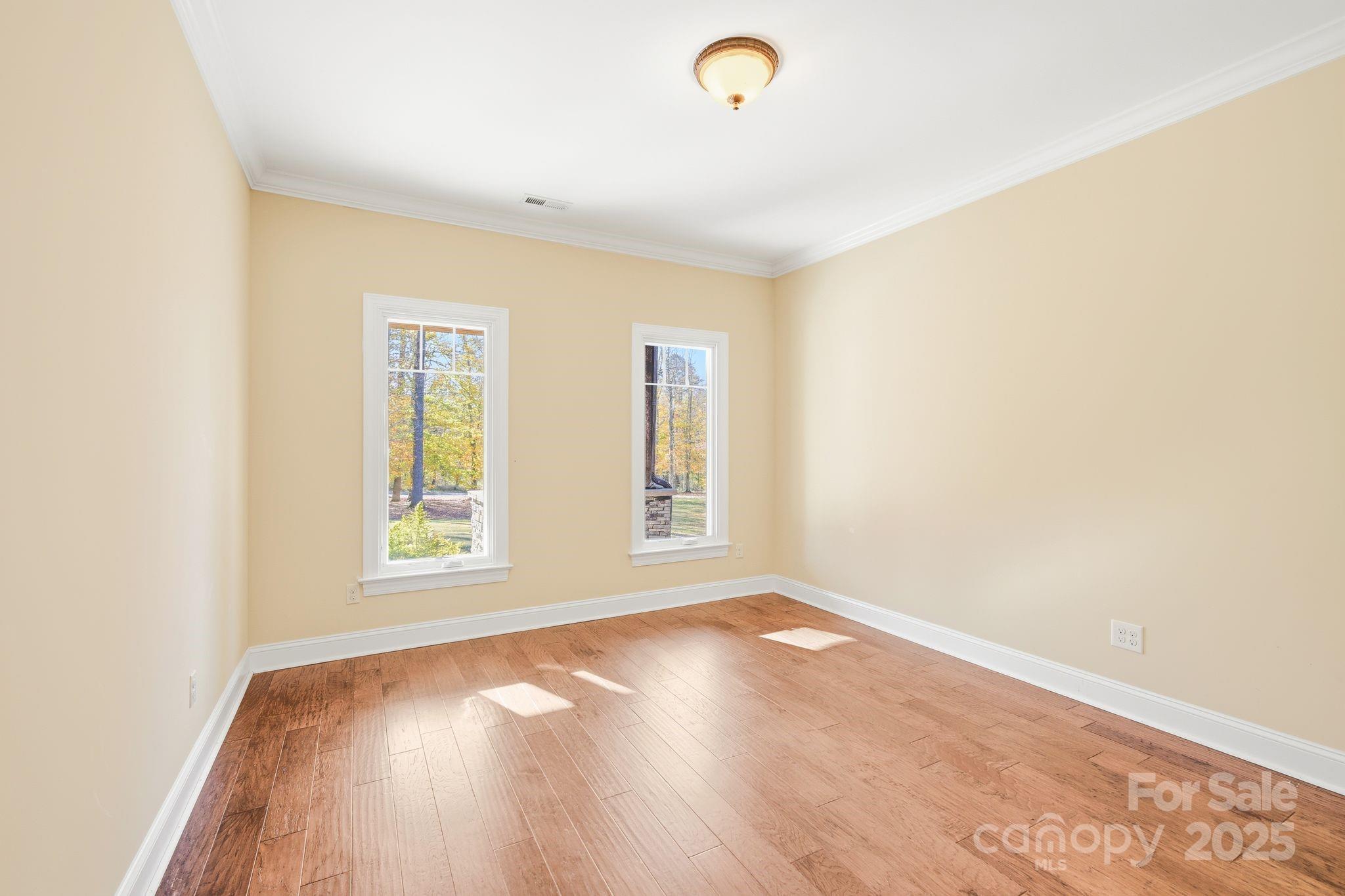 476 Ijames Church Road Mocksville, NC 27028 - Photo 15 of 48 an empty room with wooden floor and windows