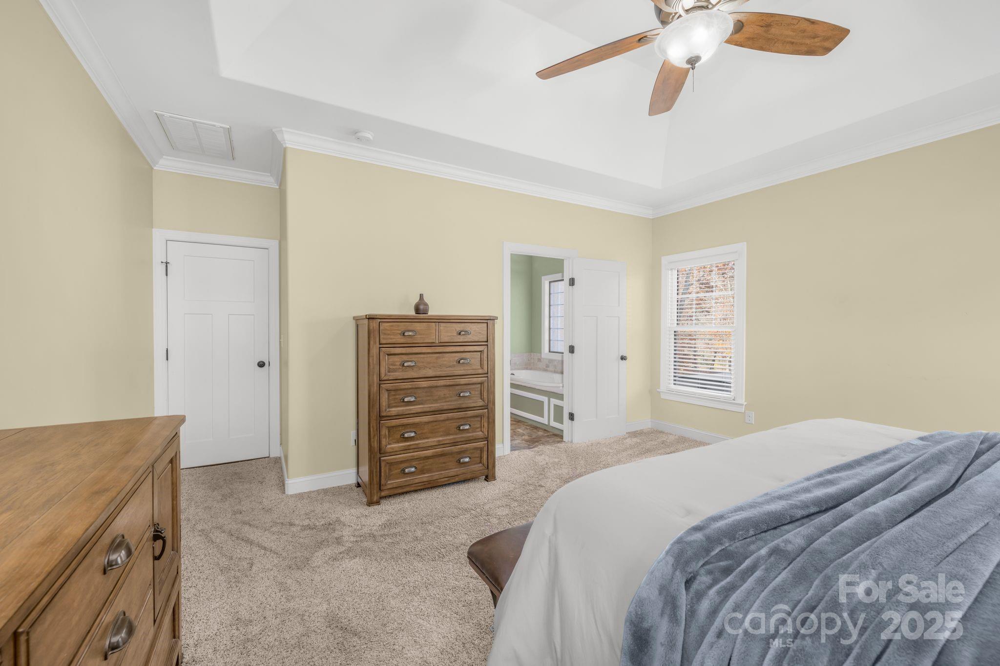 476 Ijames Church Road Mocksville, NC 27028 - Photo 18 of 48 a bedroom with a bed and a walk in closet