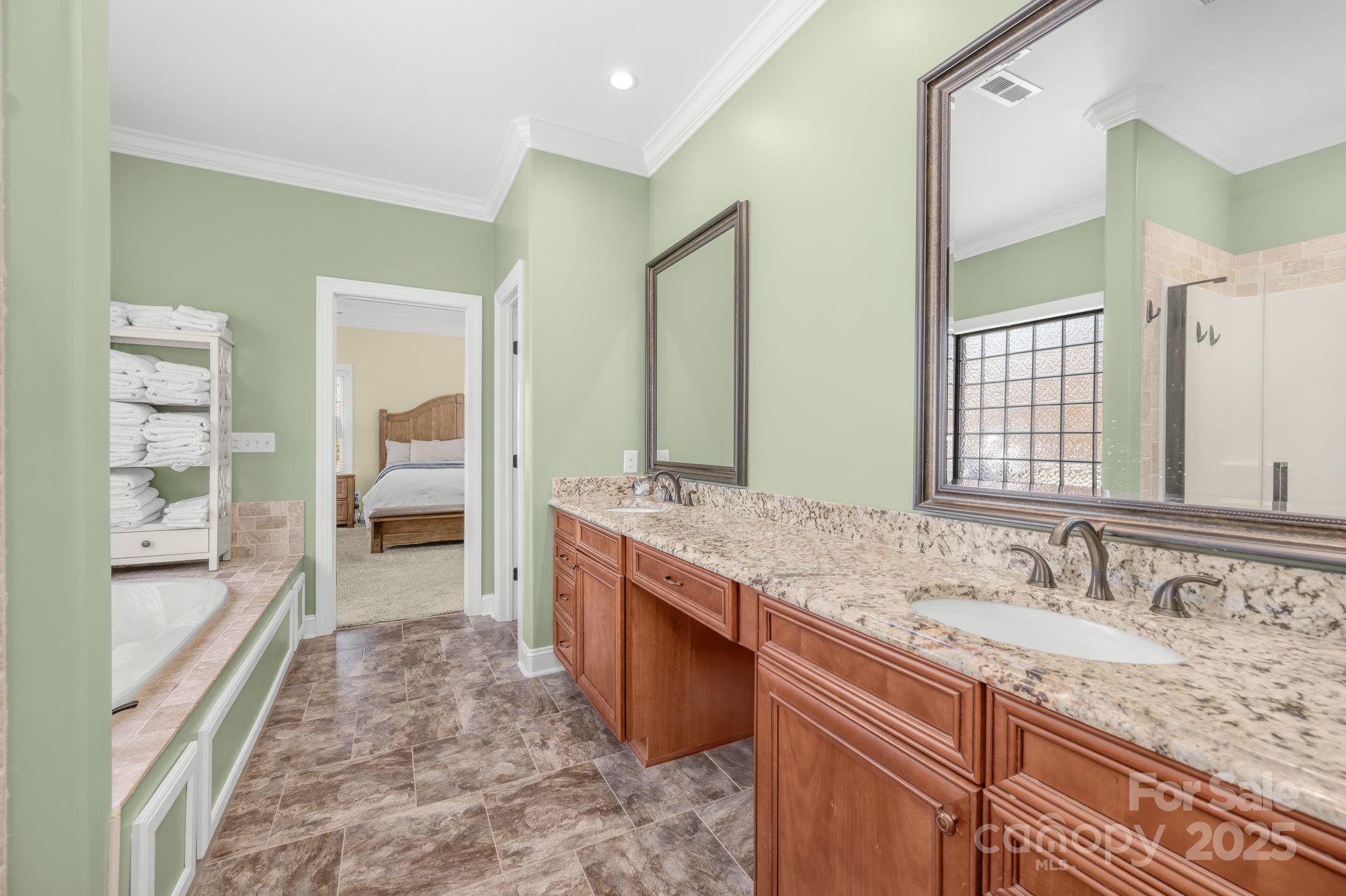476 Ijames Church Road Mocksville, NC 27028 - Photo 21 of 48 a spacious bathroom with a granite countertop sink a mirror and a