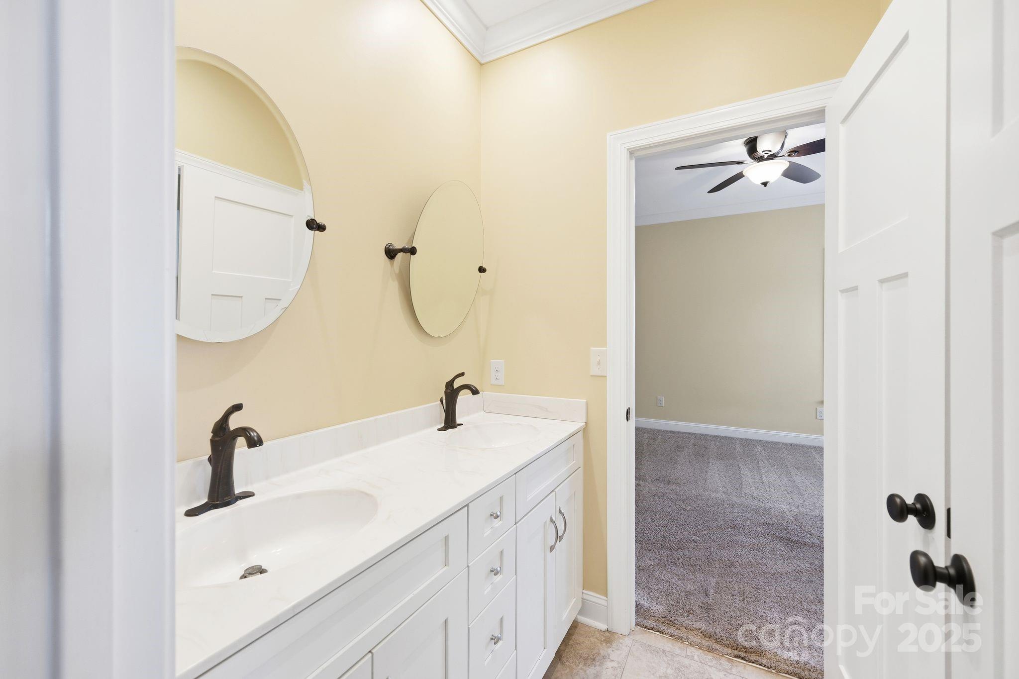 476 Ijames Church Road Mocksville, NC 27028 - Photo 23 of 48 a bathroom with a double vanity sink a mirror and shower