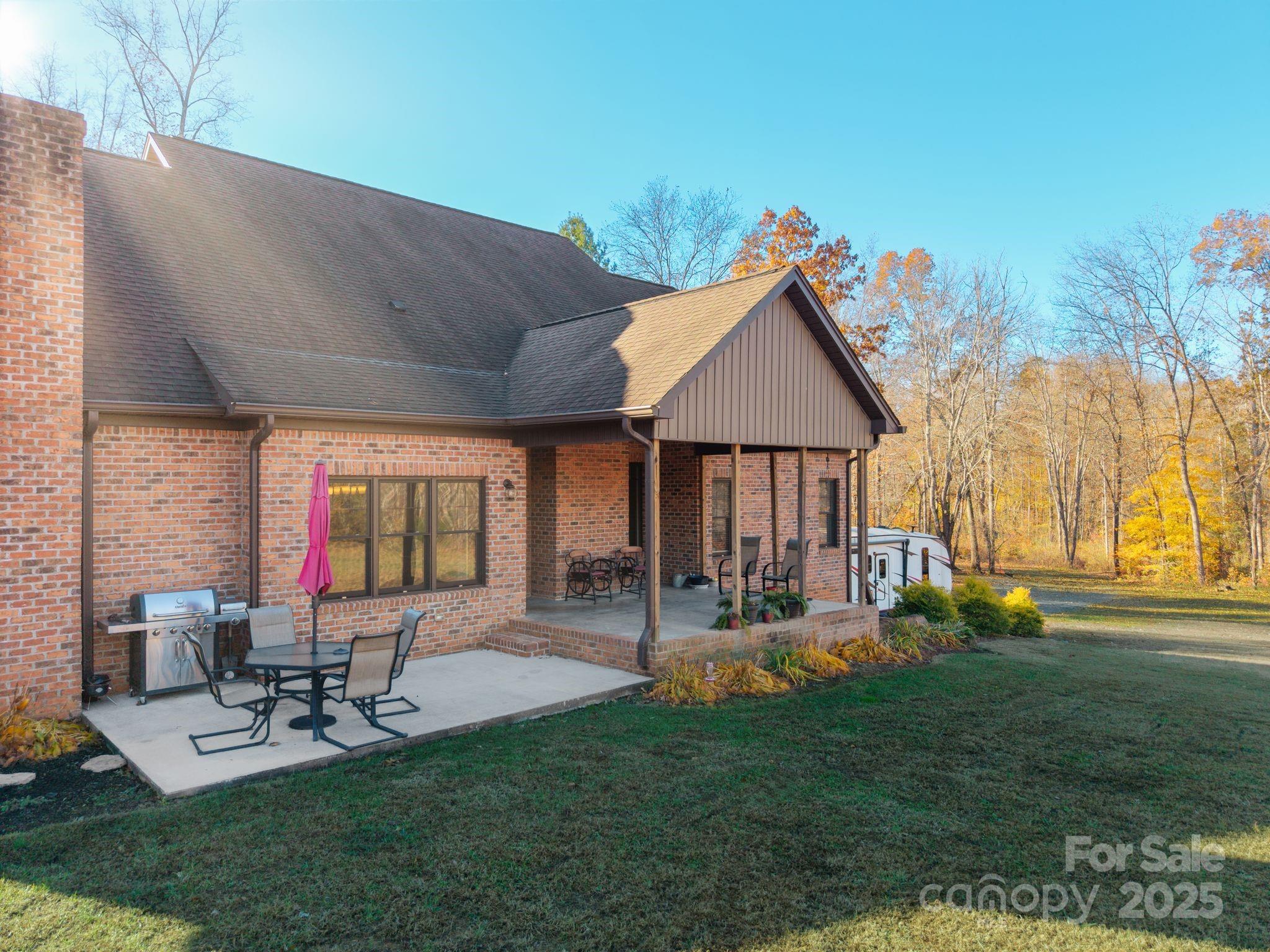 476 Ijames Church Road Mocksville, NC 27028 - Photo 41 of 48 a front view of house with a garden and patio
