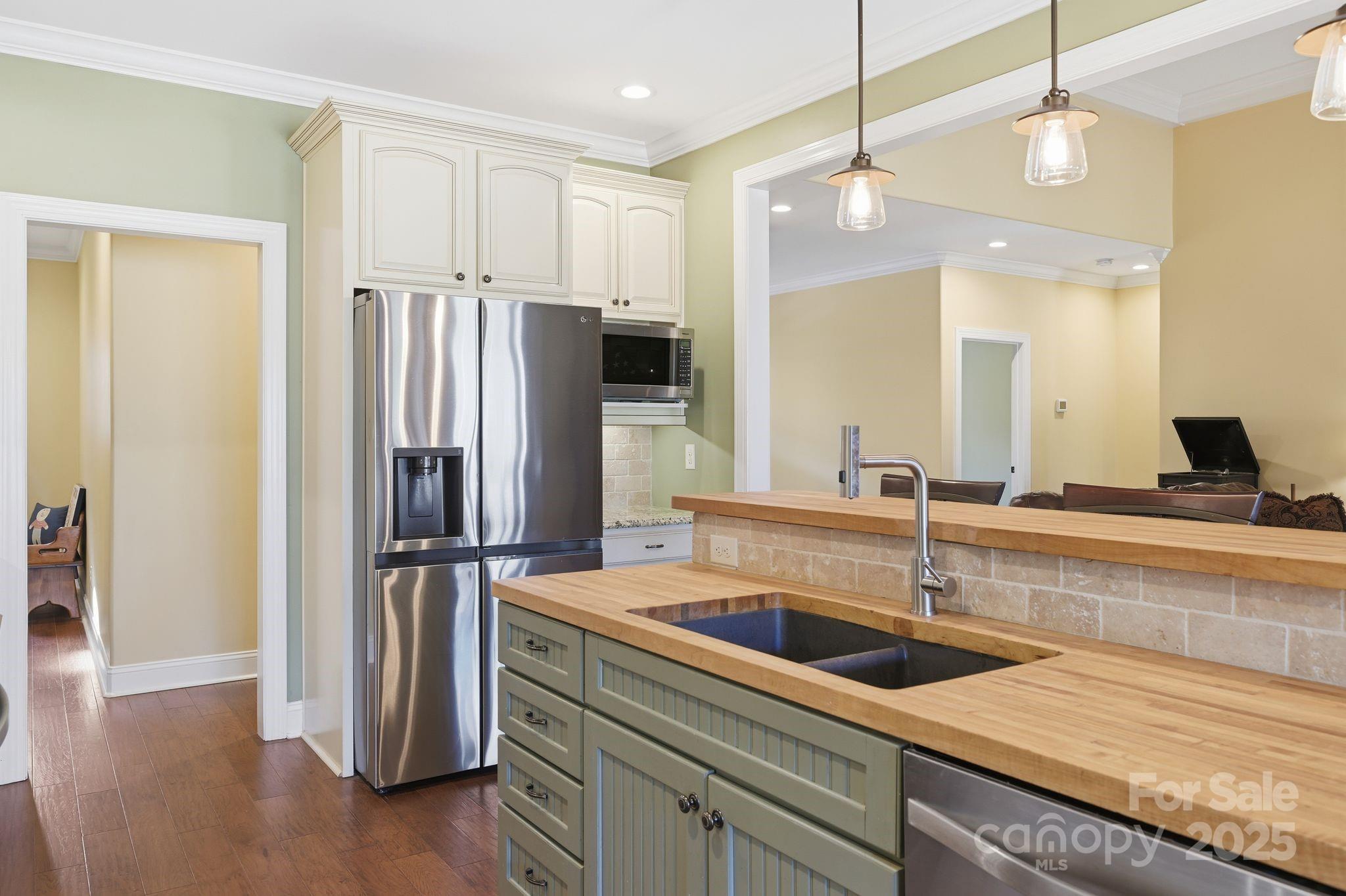 476 Ijames Church Road Mocksville, NC 27028 - Photo 9 of 48 a kitchen with kitchen island a sink appliances and cabinets