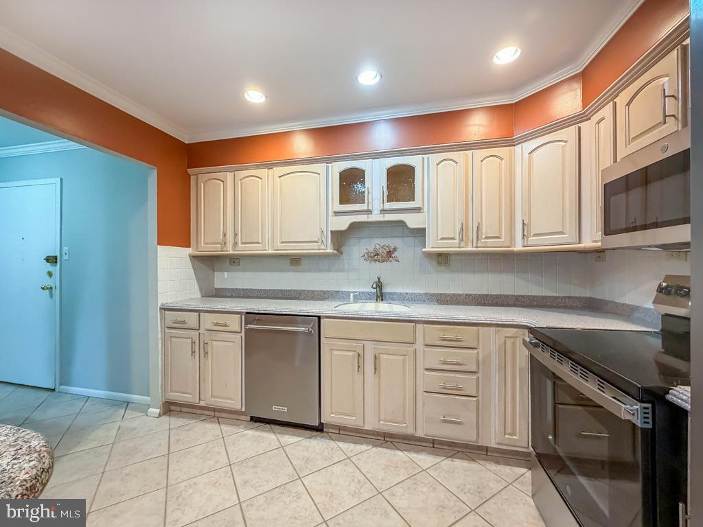 1680 Huntingdon Pike, Unit CONDO 232 Huntingdon Valley, PA 19006 - Photo 15 of 34 a kitchen with stainless steel appliances granite countertop a sink and cabinets