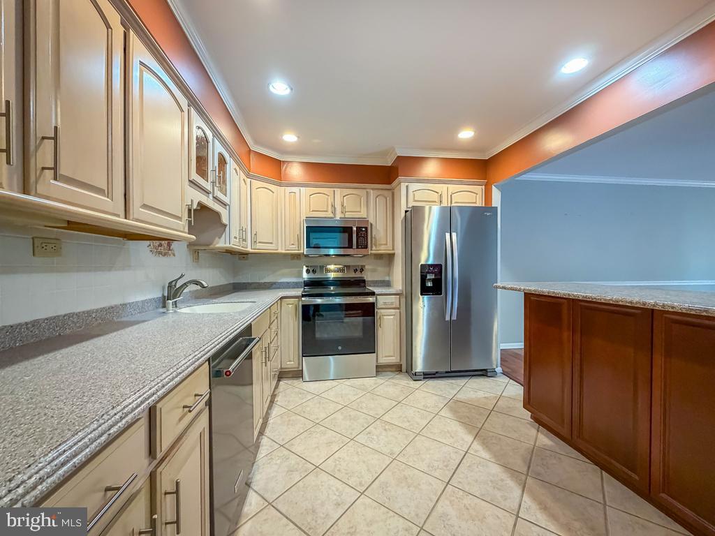 1680 Huntingdon Pike, Unit CONDO 232 Huntingdon Valley, PA 19006 - Photo 16 of 34 a kitchen with stainless steel appliances granite countertop a refrigerator and a sink