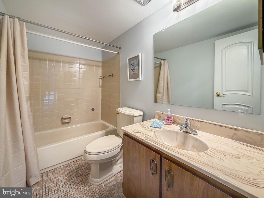 1680 Huntingdon Pike, Unit CONDO 232 Huntingdon Valley, PA 19006 - Photo 23 of 34 a bathroom with a granite countertop sink toilet and shower