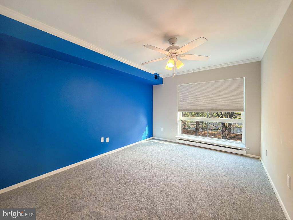 1680 Huntingdon Pike, Unit CONDO 232 Huntingdon Valley, PA 19006 - Photo 26 of 34 an empty room with a window and a ceiling fan