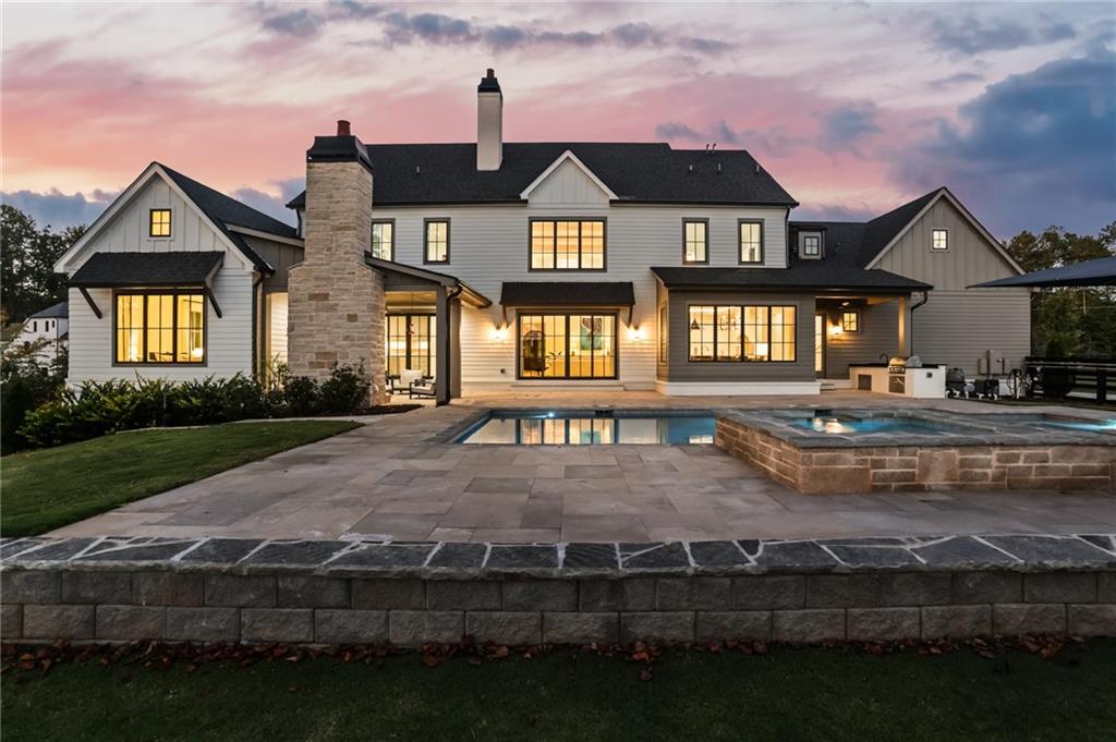 1050 Little River Lane Milton, GA 30004 - Photo 91 of 95 a front view of a house with garden