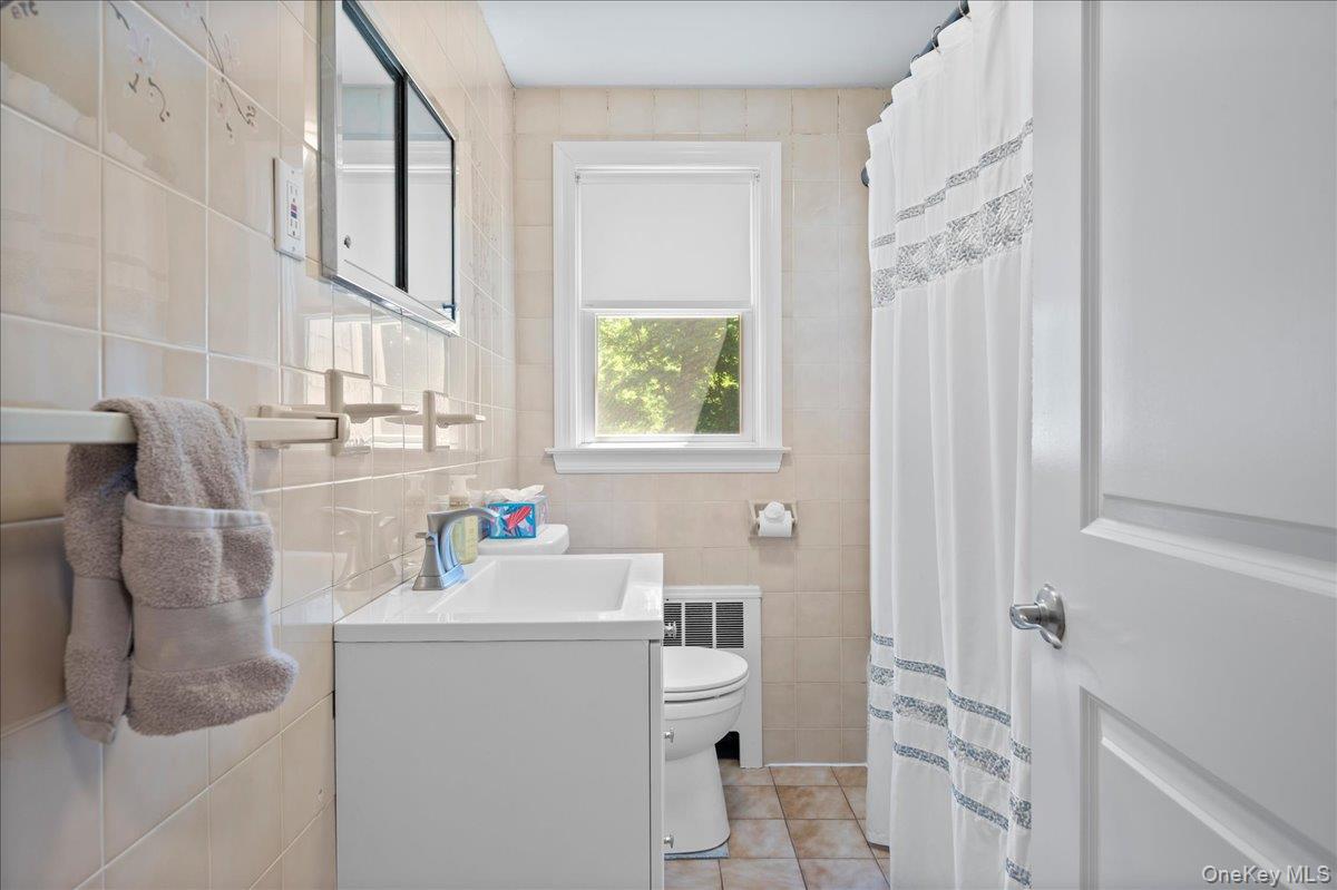 105 High St Extension Mount Kisco, NY 10549 - Photo 26 of 38 a bathroom with a sink toilet and shower