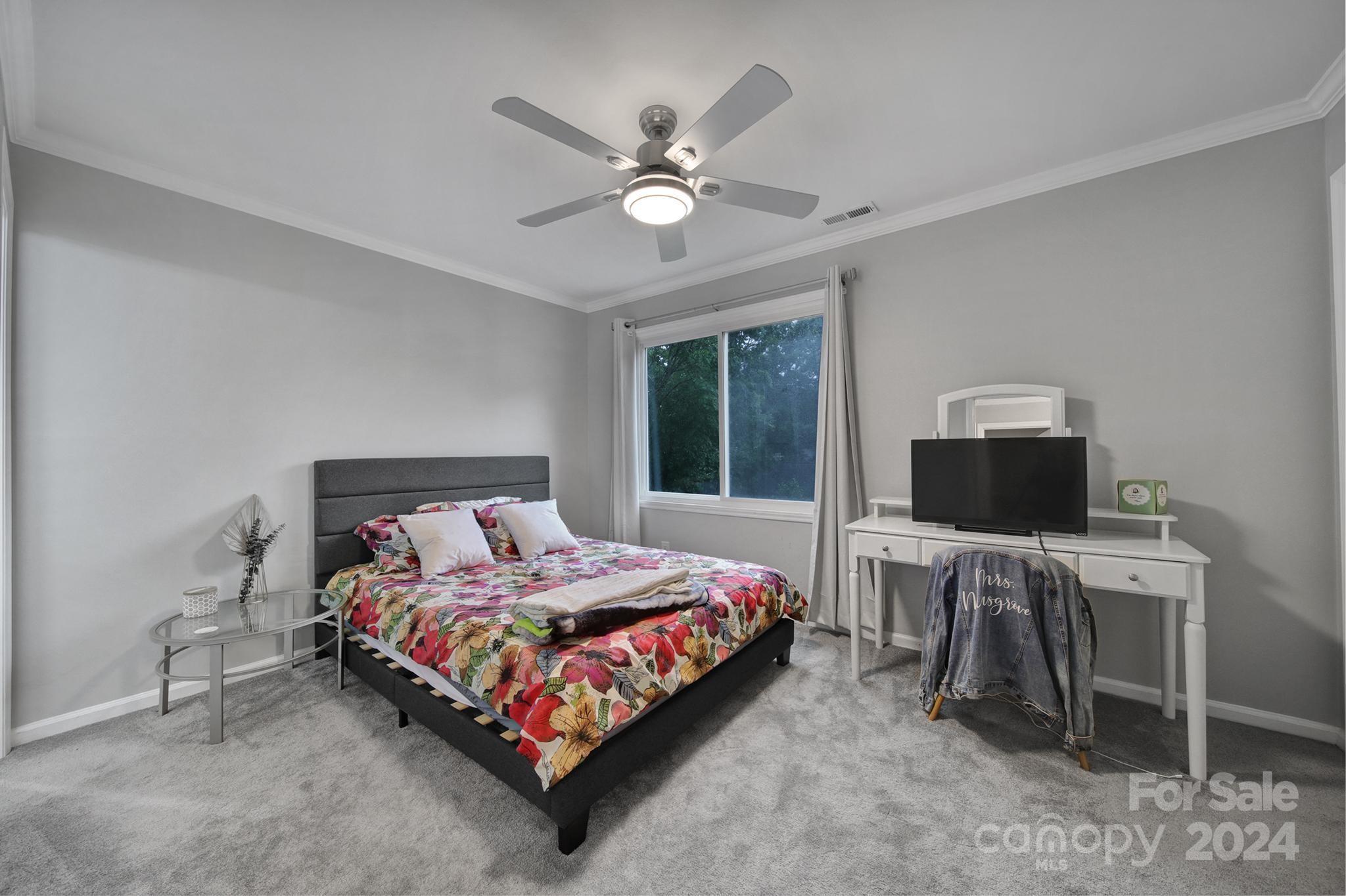 9119 Windjammer Drive Tega Cay, SC 29708 - Photo 16 of 40 a bedroom with a bed and a desk