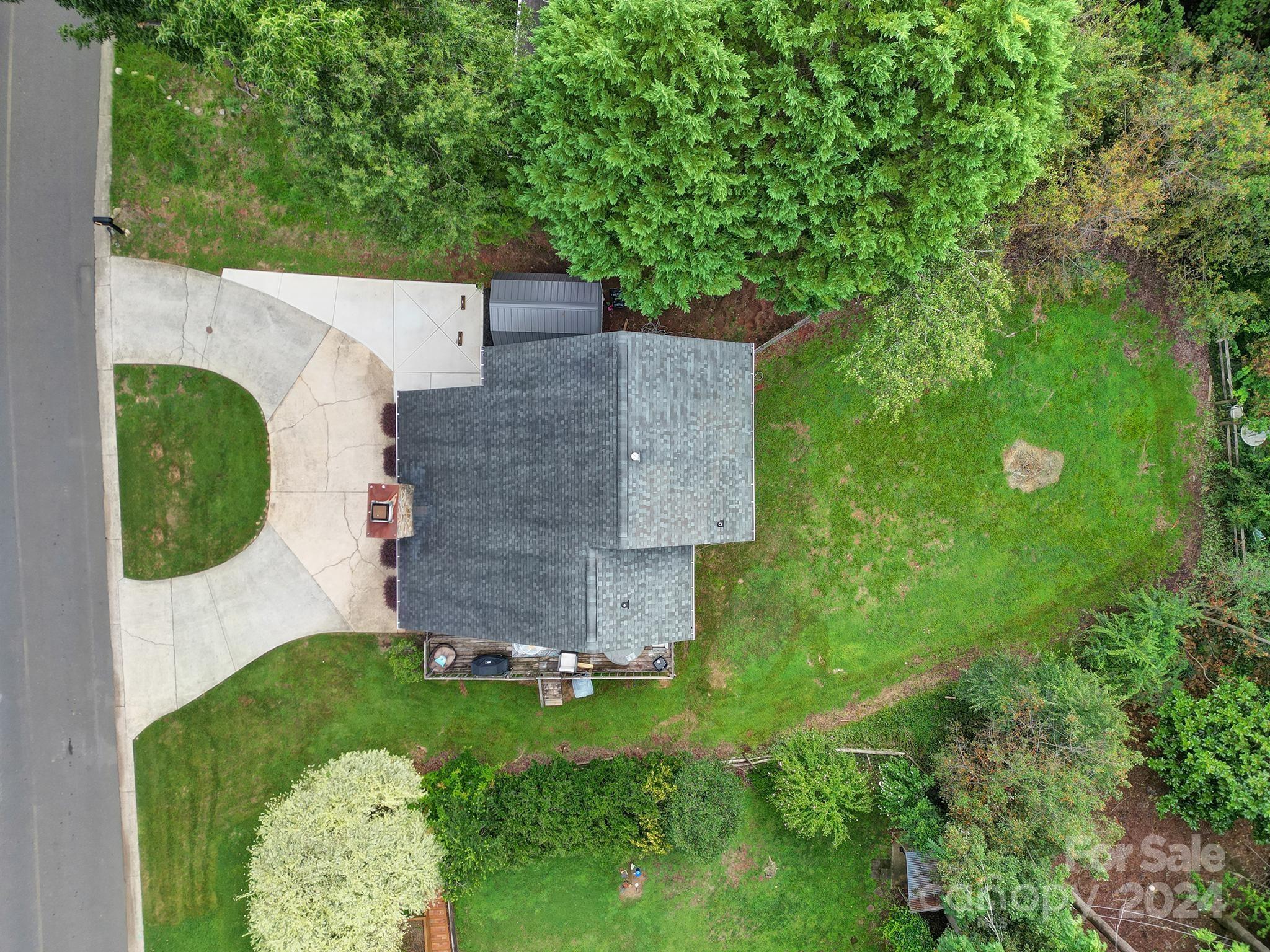 9119 Windjammer Drive Tega Cay, SC 29708 - Photo 25 of 40 an aerial view of a house with a garden and trees