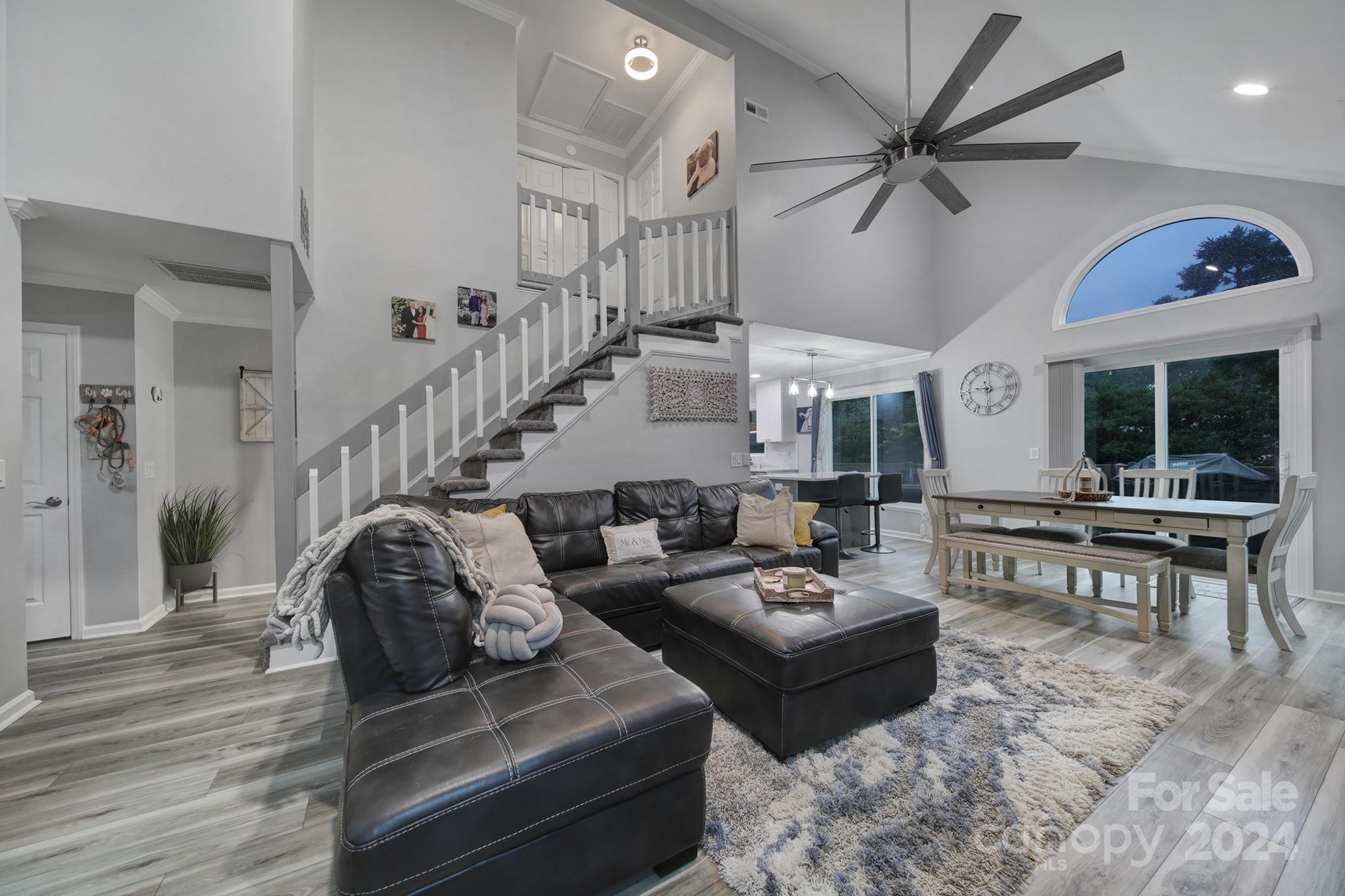 9119 Windjammer Drive Tega Cay, SC 29708 - Photo 3 of 40 a living room with furniture and a wooden floor
