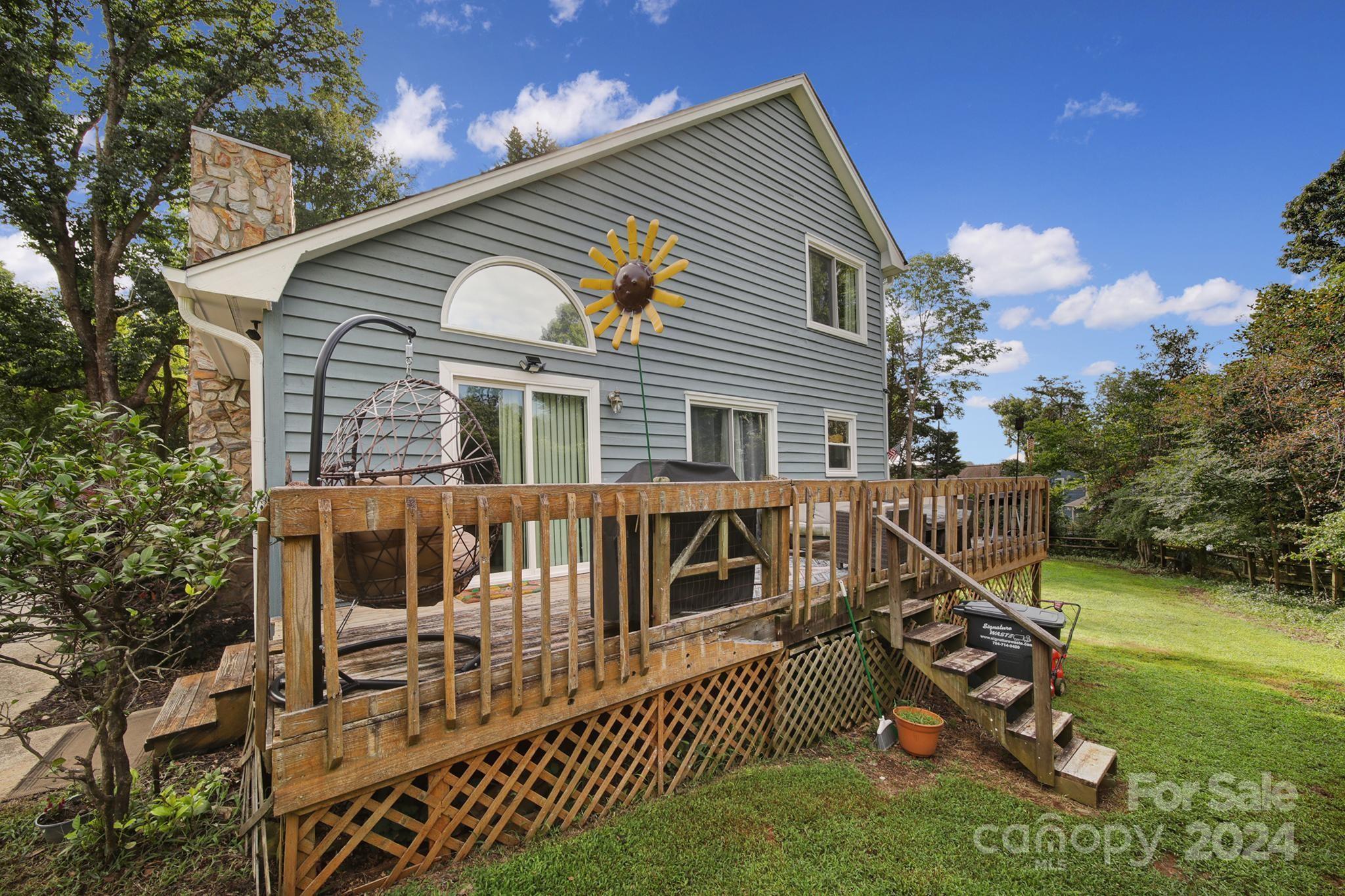 9119 Windjammer Drive Tega Cay, SC 29708 - Photo 36 of 40 a view of a house with a wooden deck